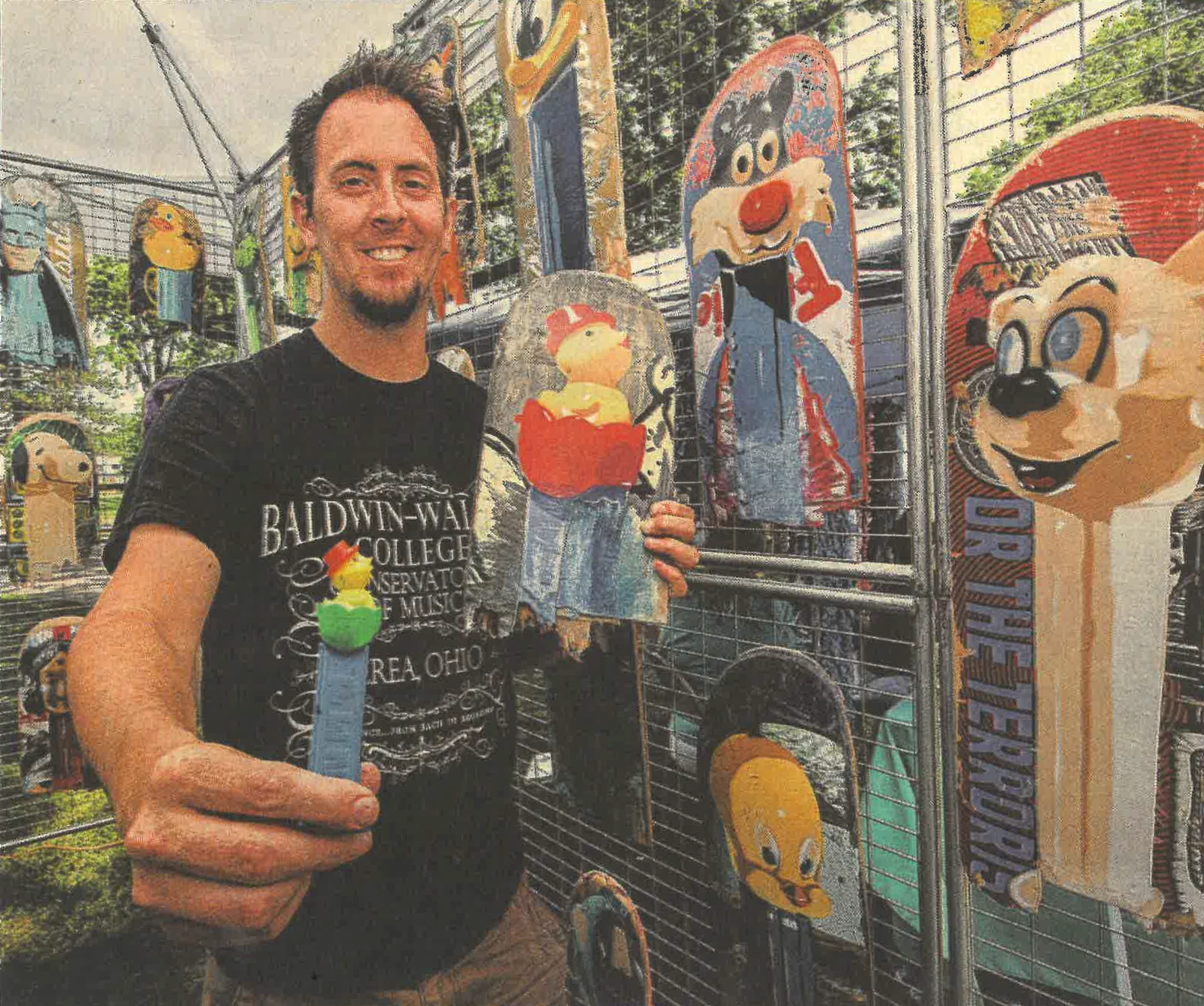 pez artist rich Cihlar holding skateboard art